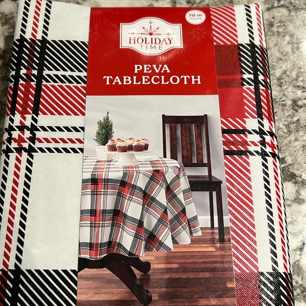Holiday Time 70” round black and white plaid PEVA tablecloth. New